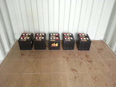 The first batteries set out at the rear of the container.