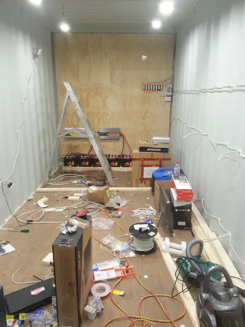 Ceiling lights and wall wiring installed while the container is still unlined.