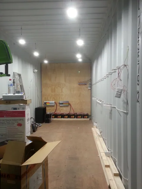 The lit interior with cables and outlet boxes in place.
