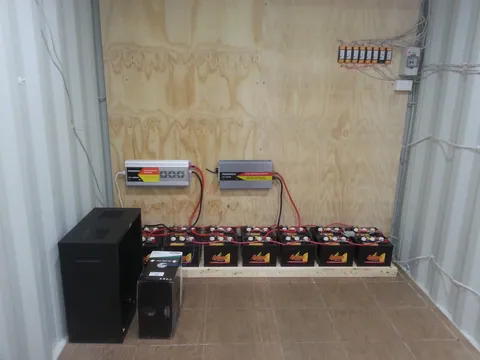 The rear equipment wall and batteries before the internal partition.