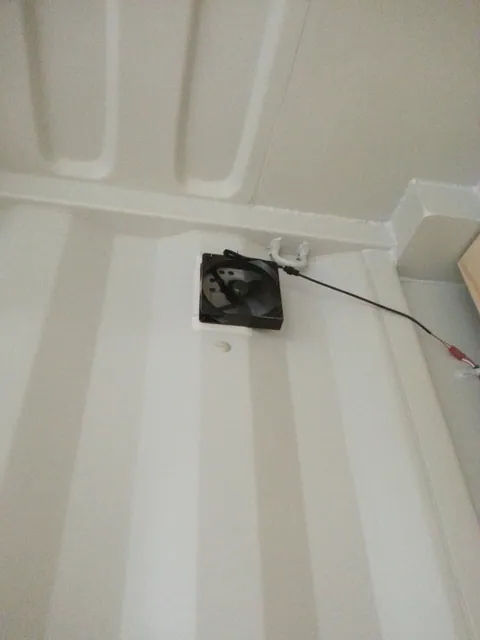 A small camera mounted near the ceiling.