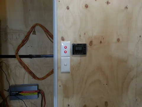 The control panel and switches beside the service-area door.