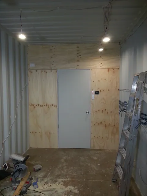 The lined partition with the service-area door closed.