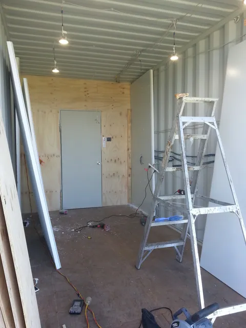 Lining sheets and a ladder set out for work on the interior.