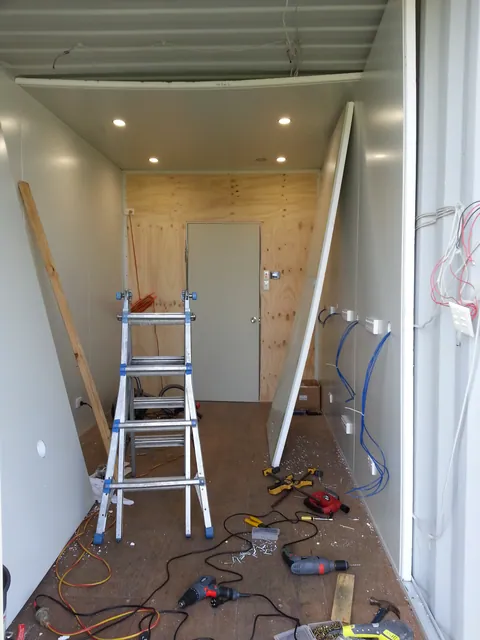 Working on the ceiling lining and recessed light positions.