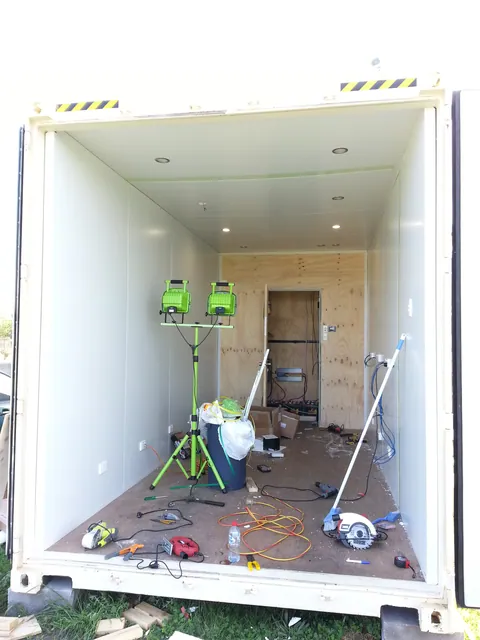 The lined workshop viewed through the open cargo doors.