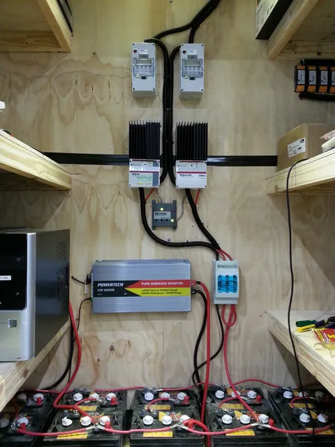 The battery bank, inverter and controllers together in the service area.