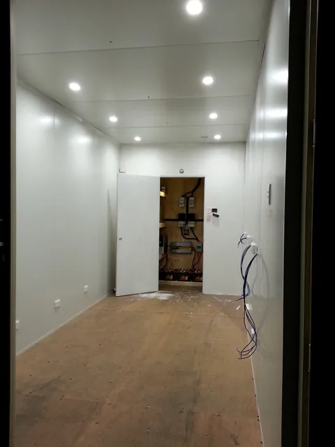 The fully lined main room with its ceiling lights operating.