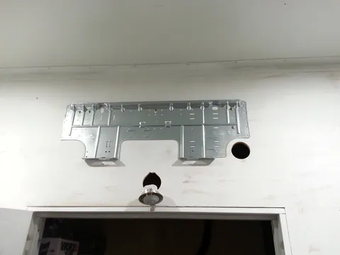 The mounting bracket and wall opening for the indoor air conditioner.