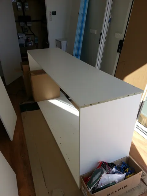 The first tall cabinet being assembled.