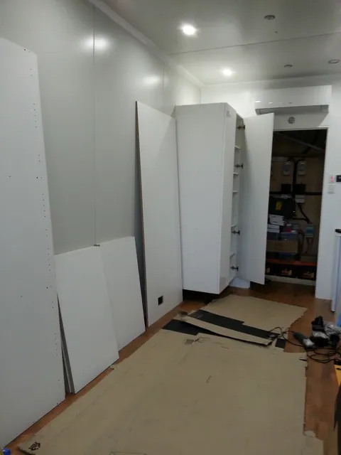 More tall storage cabinetry added along the wall.