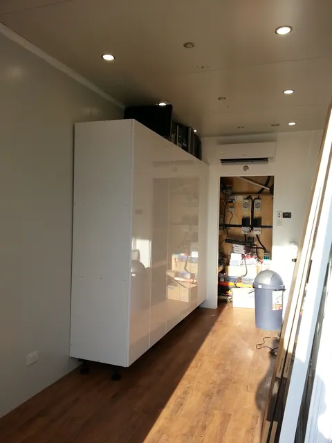 The tall cupboards viewed in daylight.