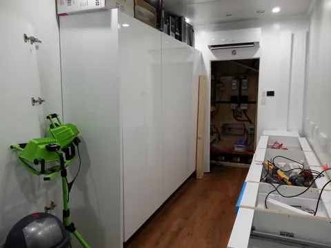 Storage and bench cabinetry now facing one another.
