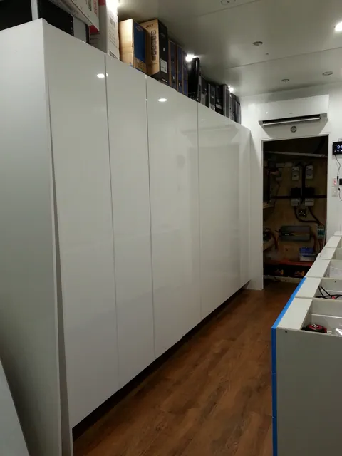 The completed wall of storage cupboards.