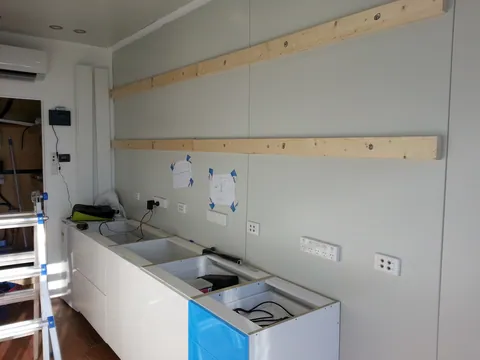 Wall battens fixed for the upper cabinets.