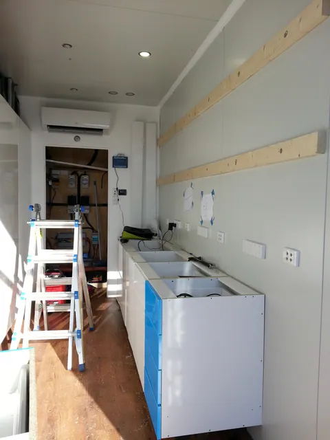 The benchtop side prepared for the next cabinet installation.