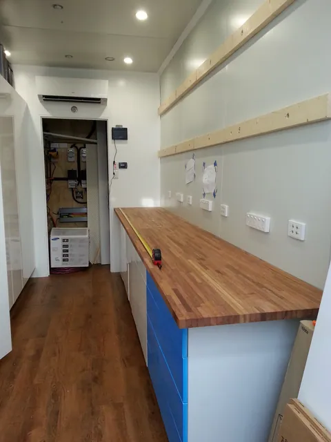The timber benchtop fitted above the base cabinets.