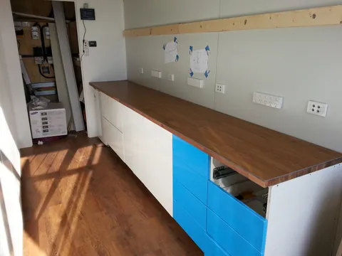 A closer view of the fitted timber benchtop and drawers.