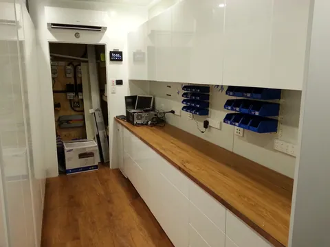 Protective film removed to reveal the finished white cupboards.