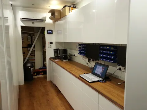 The fitted workshop with a computer on the new repair bench.