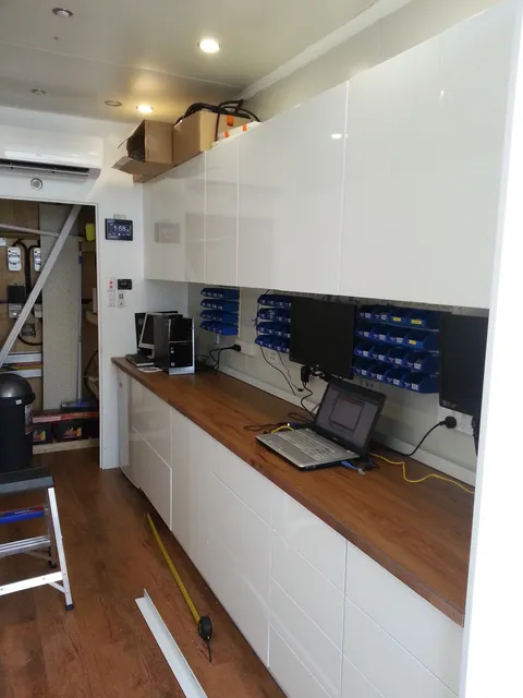 The completed cabinetry and repair bench photographed the next day.