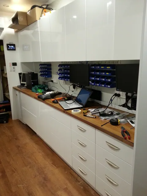Computers and tools in use on the newly fitted bench.