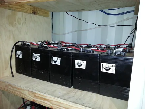 The later battery bank on its timber shelf in the service area.