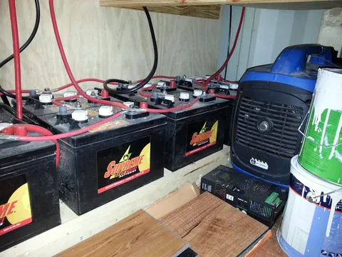 The battery connections and equipment at the side of the service area.