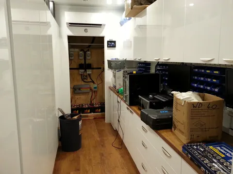 The fitted room with the service-area door open.