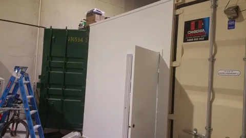 Containers and new partitions share the warehouse space.