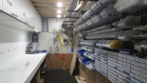 The existing repair bench, already surrounded by tools and parts.