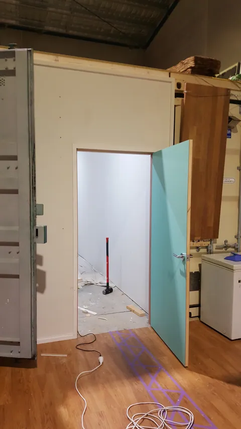 The doorway from outside shows how the new room sits beside the existing structure.