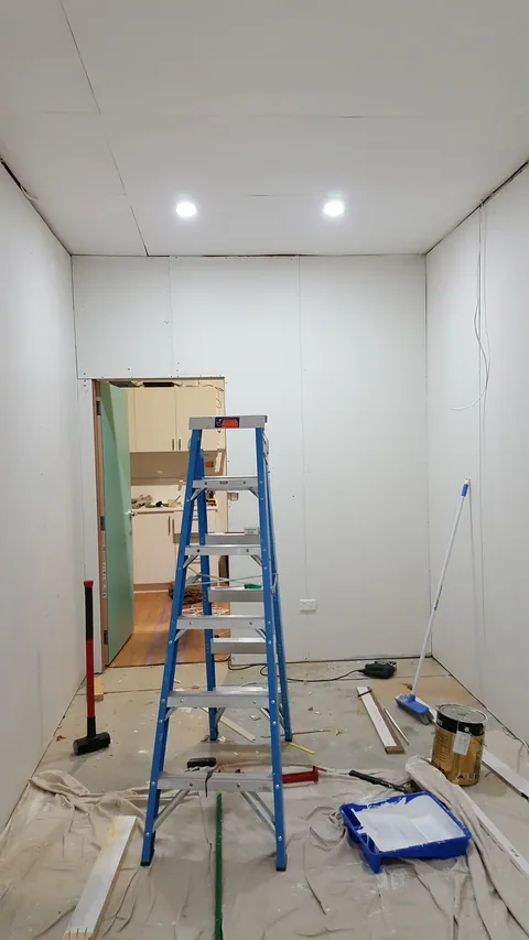 The room is now fully lined and lit.