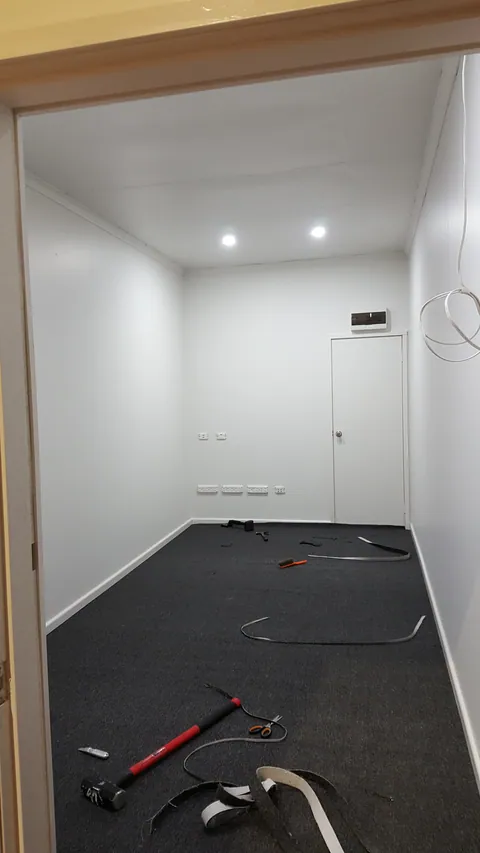 Carpet replaces the exposed timber floor.
