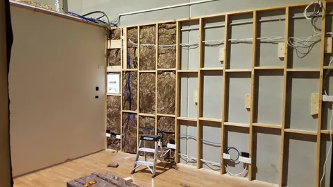 Insulation is fitted partway across the display wall.