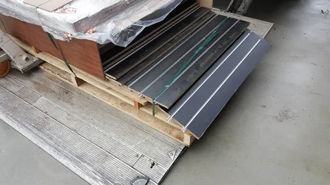 A delivery of slatwall panels waits to be fitted.