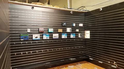 The first stock begins to appear on the display wall.
