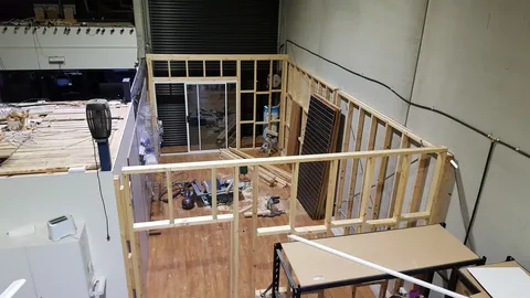 An elevated view shows the footprint of the new framed area.