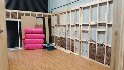 More wall bays are filled with insulation.