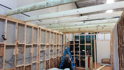 Joists now span the length of the area.