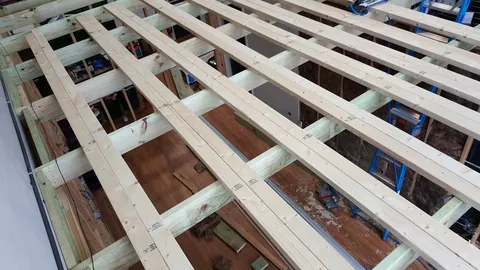 From above, the ceiling battens form a grid ready for lining.