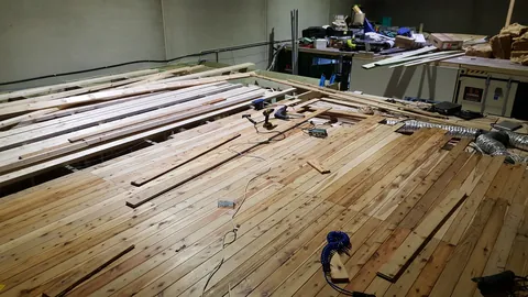The timber lining extends farther across the ceiling.