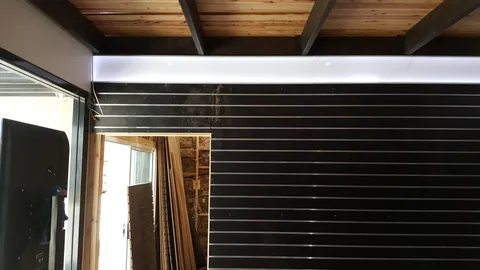White upper trim is added around the display walls.
