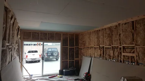 The ceiling is covered while the walls remain unfinished.
