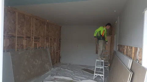 Wall panels now cover most of the room.