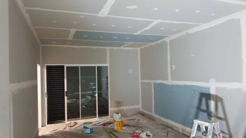 The lined room shows the pattern of freshly filled joints.