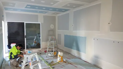 Wall preparation continues the following day.