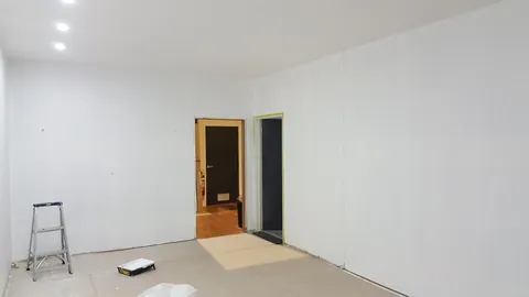 Painted walls and the timber doorframe mark the next stage.