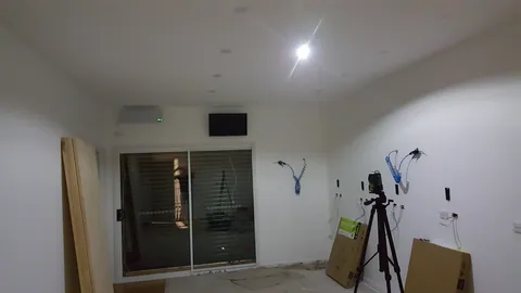 A screen is mounted above the sliding doors.