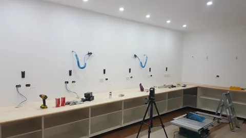 A perimeter benchtop is laid in place.